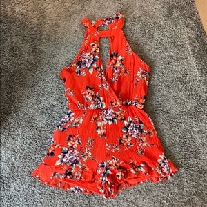 Bright orange floral romper